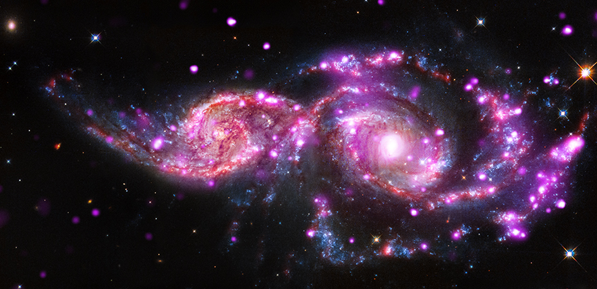 Составное изображение галактик NGC 2207 и IC 2163, находящихся в процессе слияния. Изображение было сделано с использованием рентгеновских данных от Chandra, а также инфракрасных и оптических данных от Hubble и Spitzer. Авторы и права: Рентгеновский снимок: NASA / CXC / SAO / S.Mineo и др., Оптический: NASA / STScI, инфракрасный: NASA / JPL-Caltech