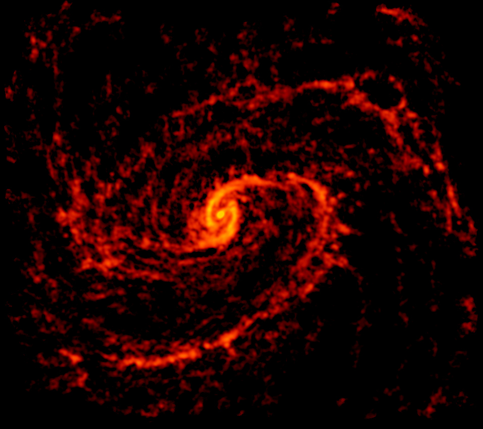 Радиоизображение галактики NGC 4321 (Messier 100), полученное с помощью ALMA. Предоставлено: ALMA (ESO / NAOJ / NRAO); NRAO / AUI / NSF, Б. Сакстон
