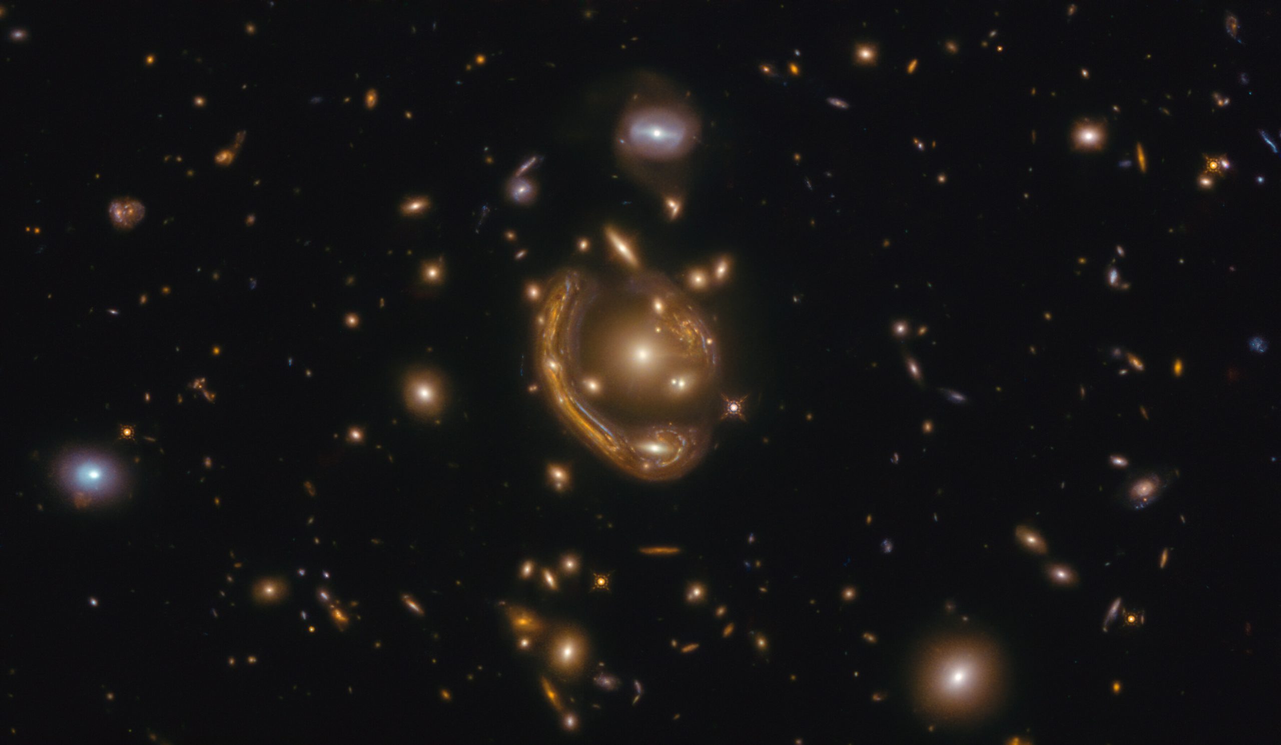 Февраль месяц включает изображение кольца Эйнштейна, известного как GAL-CLUS-022058s. Предоставлено: ЕКА / Хаббл и НАСА, С. Джа.