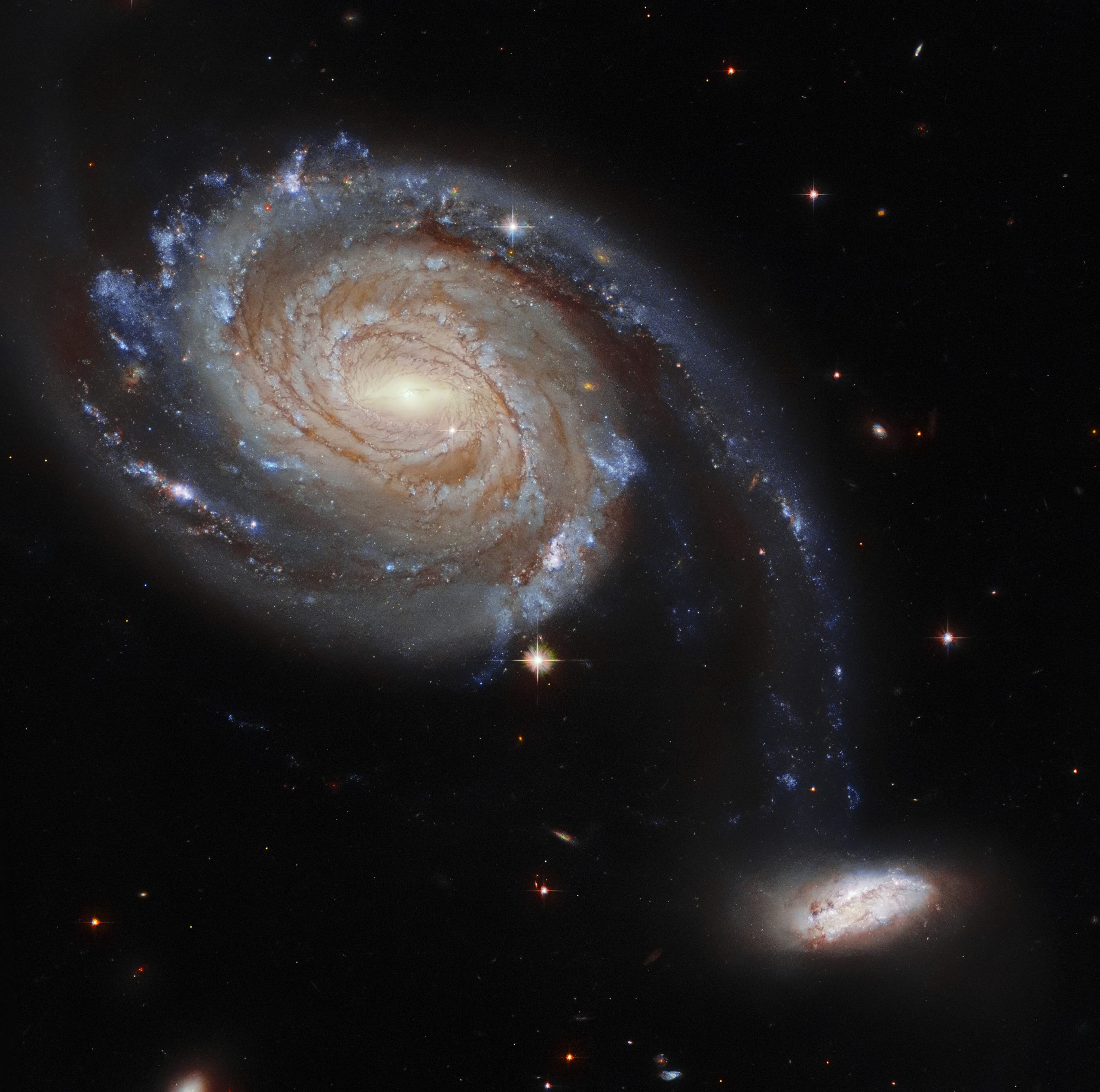 В марте есть изображение пары взаимодействующих галактик под названием «Апрель 86», расположенных на расстоянии 220 миллионов световых лет от нас. Предоставлено: ЕКА / Хаббл и НАСА, Исследование темной энергии, Дж. Далкантон.